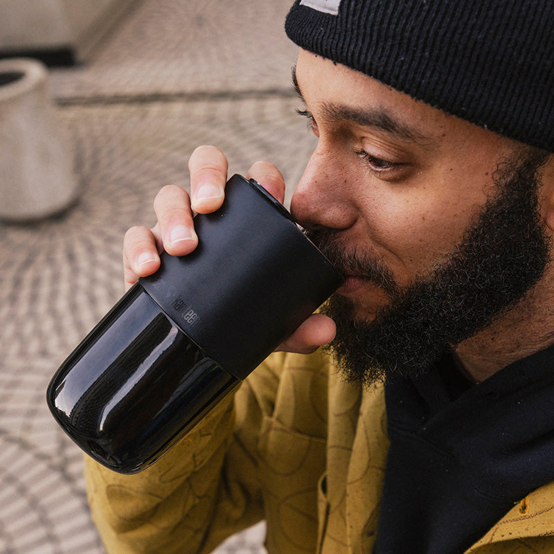 16oz-rise-tumbler-m0 16oz_rise_tumbler_black_man_drink_square.jpg